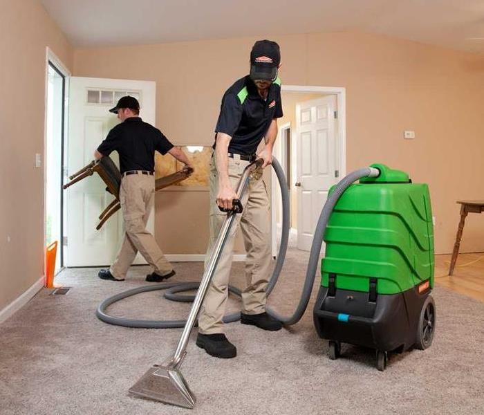 Pictured are Servpro technicians performing a carpet cleaning.